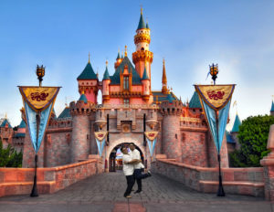 students posing in front of castle