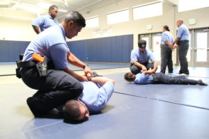 Police Academy Students Practicing Arrest Techniques