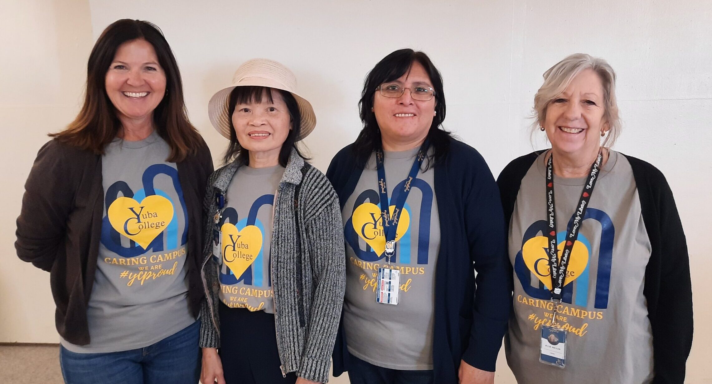Yuba College employees wearing Caring Campus branded t-shirts and smiling